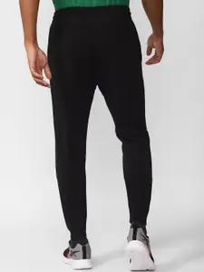 Reebok Men Ri Arch Logo Printed Pure Cotton Joggers