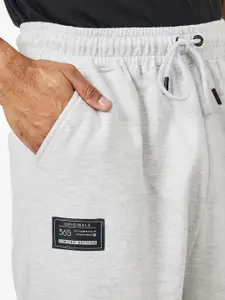 Styli Men Placement Print Oversized Jogger with Badge Detail