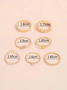 YU FASHIONS Set Of 7 Gold-Plated Stone Studded Heart Cross Twisted Link Finger Rings