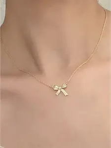 StyleCast Gold-Toned Stone Studded Bow Shaped Elegant Pendant With Chain