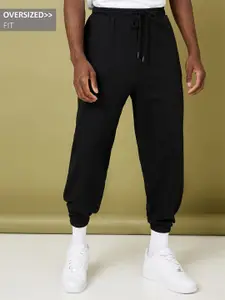 Styli Men Black Solid Oversized Fit Elastic Cuff Joggers
