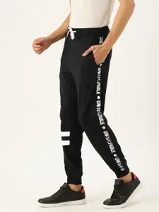 VEIRDO Men Black Solid Regular Fit Joggers With Printed Side Stripes