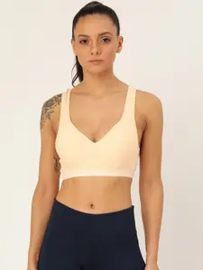 Lady Lyka Cream-Coloured Solid Non-Wired Lightly Padded Racerback Sports Bra PROVOGUE