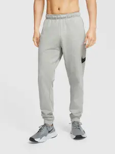 Nike Men Grey Solid Dri-FIT M NK Tapered Fit Training Joggers With Printed Detailing