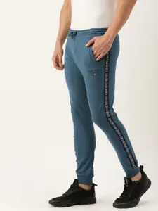 The Indian Garage Co Men Teal Blue Solid Joggers with Side Tape Printed Detail