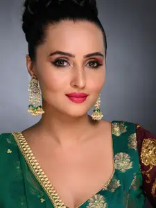 Sukkhi Green Gold-Plated Kundan Studded Enamelled Contemporary Jhumkas