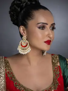 Sukkhi Maroon Gold-Plated Kundan Studded Handcrafted Crescent Shaped Chandbalis