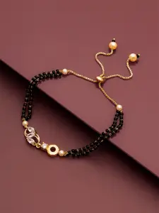 aadita Women Gold-Toned & Black Brass American Diamond Handcrafted Gold-Plated Charm Bracelet
