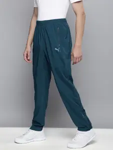 Puma Puma Men Teal Blue Solid Tapered Woven Running Track Pants