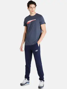 Puma Men Blue Solid Zippered Jersey Track Pants