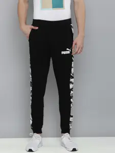 Puma Men Black Brand Logo Printed Mid-Rise Regular Joggers With Printed Side Stripes