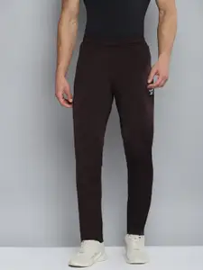 Reebok Men Brown Solid Knitted Training Track Pants