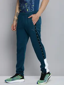 one8 x PUMA Men Colourblocked Virat Kohli Woven Slim Fit Track Pants With Side Stripes
