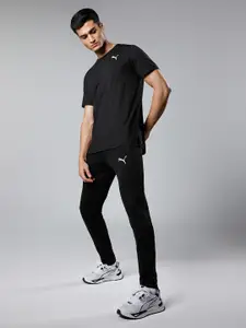 Puma Men Black Solid Evostripe Mid Rise Elasticated Dry Cell Tapered Sustainable Track Pants