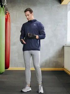 Reebok Men Navy Blue Solid Training Sporty Jacket