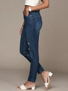 bebe Women Blue Super Skinny Fit High-Rise Low Distress Light Fade Stretchable Jeans