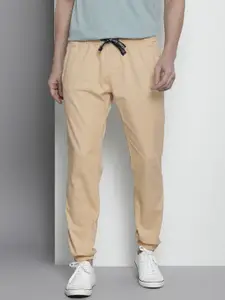 Tommy Hilfiger Men Beige Solid Slim Fit Trousers with Drawstring Closure