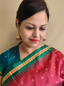 GRIIHAM Gold-Plated & Green AD Studded Classic Jhumkas Earrings