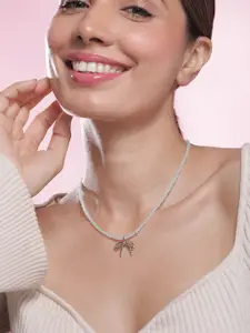 Rubans Rhodium Plated Minimalist White Beaded Necklace with Silver Bow Charm