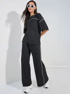 Styli Women Contrast Overlock Oversized Fit T-Shirt & Wide Leg Joggers Co-Ord Set