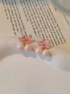 VAGHBHATT Gold-Plated Pearls Studded Bow Shaped Studs