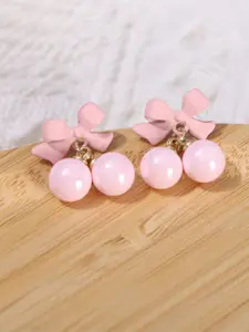 VAGHBHATT Gold-Plated Pearls Studded Bow Shaped Studs