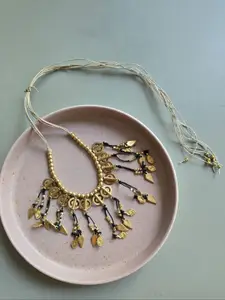 Studio Anviksha Brass charm statement necklace