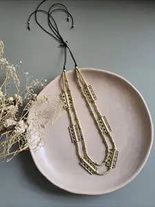 Studio Anviksha Brass beads and charms layered statement necklace