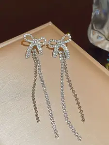 VAGHBHATT Silver-Plated Rhinestone Studded Bow Design Drop Earrings