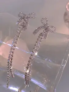 VAGHBHATT Silver-Plated Rhinestone Studded Bow Design Drop Earrings