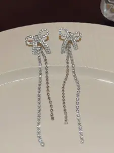 VAGHBHATT Silver-Plated Rhinestone Studded Bow Design Drop Earrings