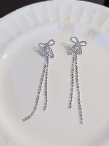 VAGHBHATT Silver-Plated Rhinestone Studded Bow Design Drop Earrings