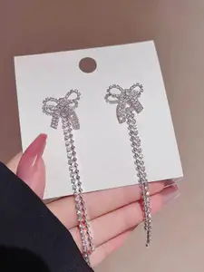 VAGHBHATT Silver-Plated Rhinestones Studded Bow Shaped Drop Earrings