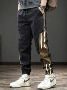 StyleCast x Revolte Men Mid-Rise Regular Fit Side Stripes Joggers