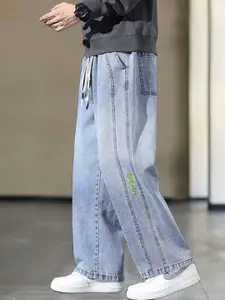 StyleCast x Revolte Men Wide Leg Light Fade Jeans