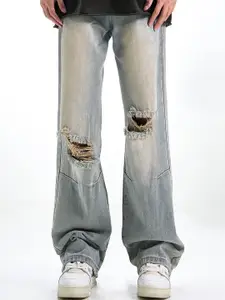 StyleCast x Revolte Men Relaxed Fit Slash Knee Light Fade Jeans