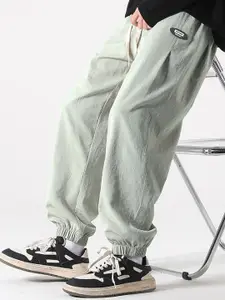 StyleCast x Revolte Men Solid Easy Wash Mid-Rise Loose Fit Joggers