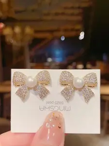 Celestique Cubic Zirconia Studded Pearls Beaded Bow Shaped Studs