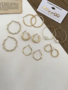Celestique Set Of 9 Gold Plated Circular Shaped Hoop Earrings