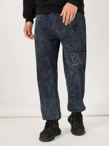 Styli Men Acid Washed Oversized Jogger With Applique Graphic