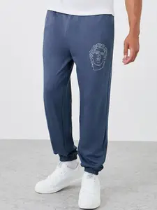 Styli Men Cotton Mid -Rise Typography Printed Relaxed Fit Joggers With Elasticated Hem
