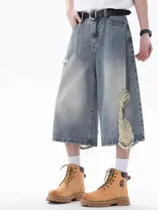 StyleCast x Revolte Men Wide Leg Mid-Rise Highly Distressed Light Fade Jeans