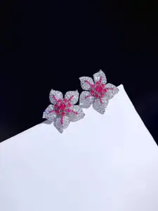 Jewels Galaxy Silver-Plated American Diamond Studded Floral Shaped Studs