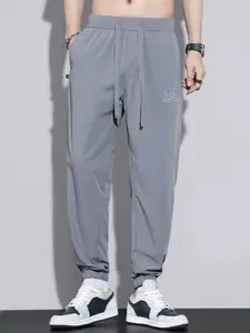StyleCast x Revolte Men Solid Regular Trousers