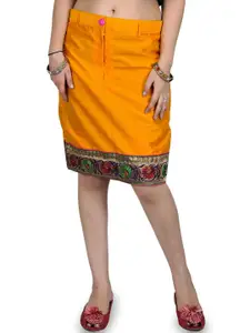 Exotic India Plain Pencil Skirt With Hand-woven Floral Patch Border