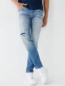 True Religion Men Skinny Fit Mildly Distressed Heavy Fade Jeans