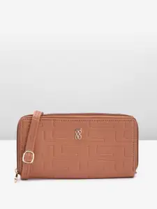 Baggit Women Abstract Textured PU Zip Around Wallet With A Sling Strap