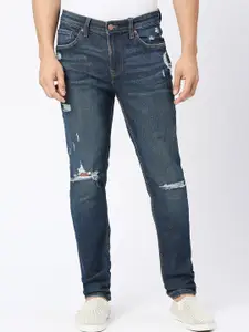 LOVEGEN Men Skinny Fit Mid-Rise Mildly Distressed Light Fade Cotton Jeans