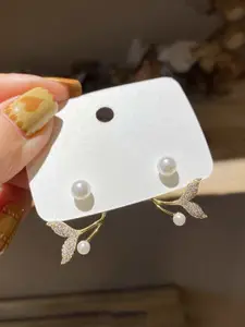 VAGHBHATT Stone-Studded Fish Tail Stud Earrings