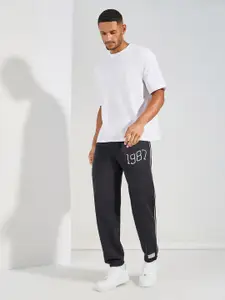 Styli Men Black Relaxed Fit Terry Joggers with Side cord and Embroidery Detail